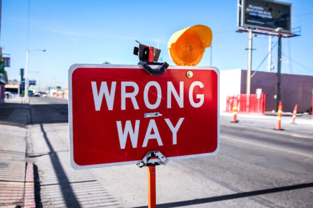 Road sign saying 'Wrong Way'. Photo by Neon Brand at Unsplash.